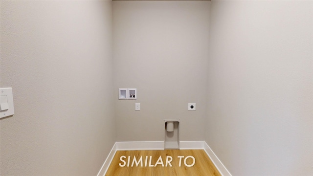 clothes washing area with washer hookup, hardwood / wood-style floors, and electric dryer hookup