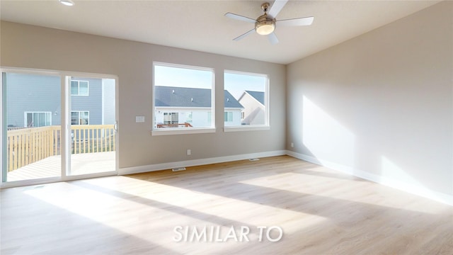 spare room featuring ceiling fan and light hardwood / wood-style flooring