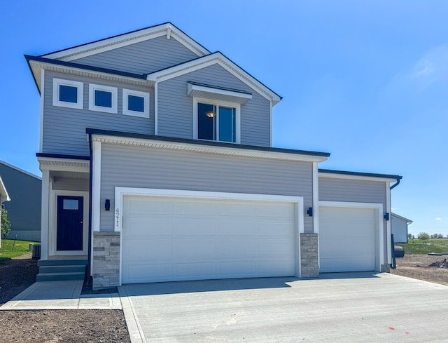 4211 5th Ave SW, Altoona, IA 50009 - view of front of property featuring stone siding, driveway, and entry steps