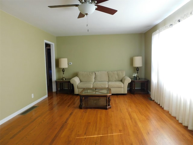 unfurnished living room with ceiling fan and light hardwood / wood-style flooring