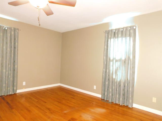 unfurnished room featuring ceiling fan and wood-type flooring