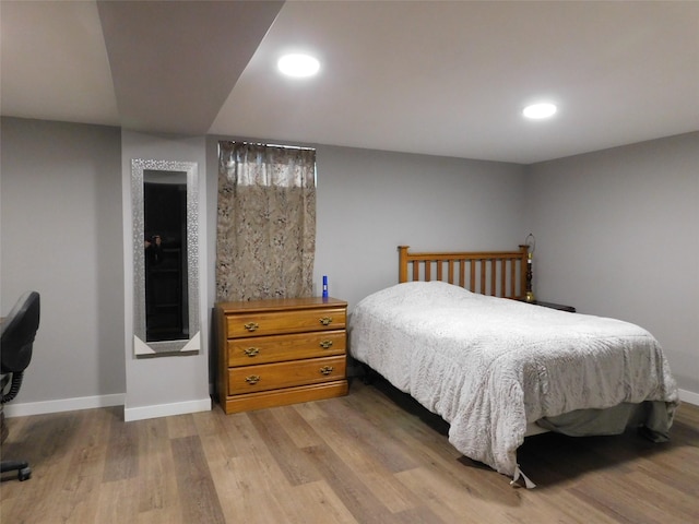 bedroom with light hardwood / wood-style flooring