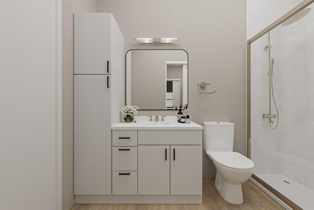 bathroom featuring a shower, toilet, vanity, and hardwood / wood-style flooring