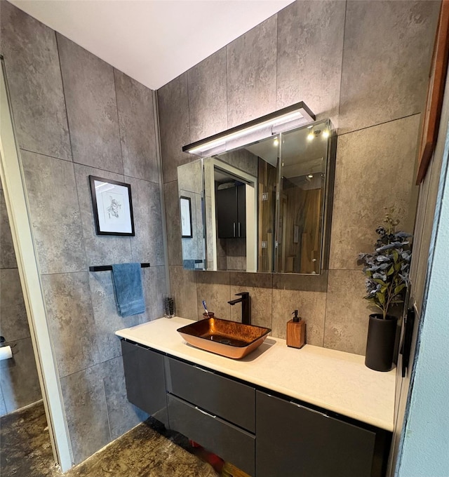 bathroom featuring tile walls and vanity