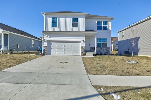 front of property with a front lawn and a garage