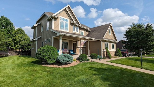 craftsman-style house with a front yard and a porch