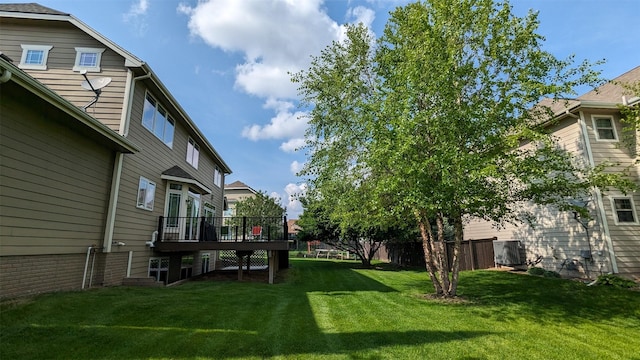 view of yard featuring a wooden deck