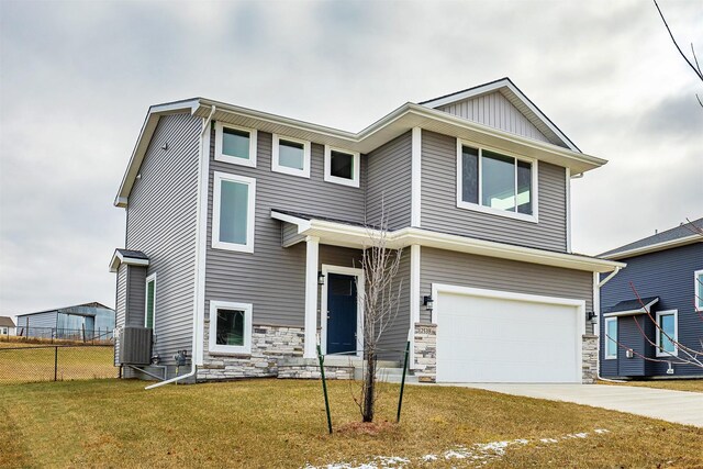 view of front facade with a front yard and a garage