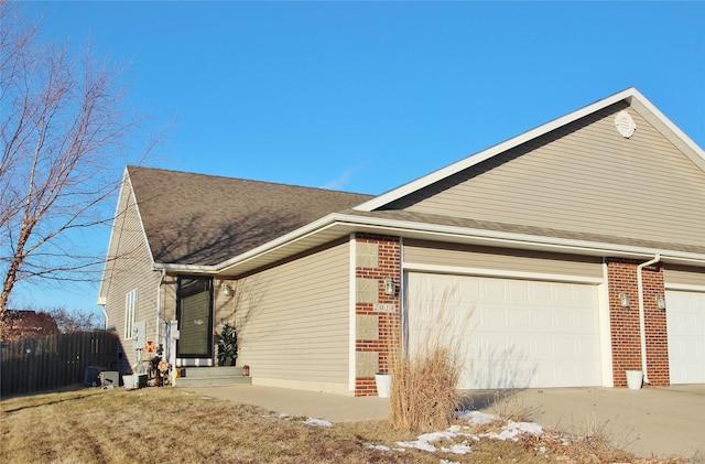 view of side of property featuring a garage