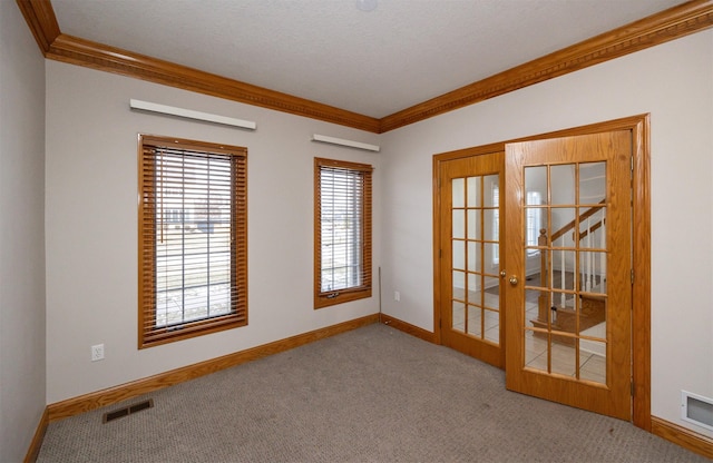 carpeted empty room featuring ornamental molding