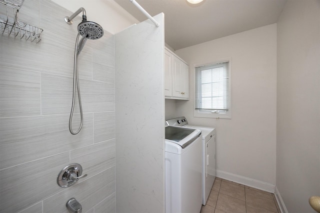 laundry room featuring light tile patterned flooring and independent washer and dryer