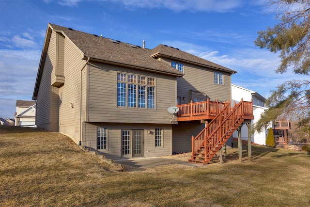 back of house featuring a wooden deck, a yard, and a patio