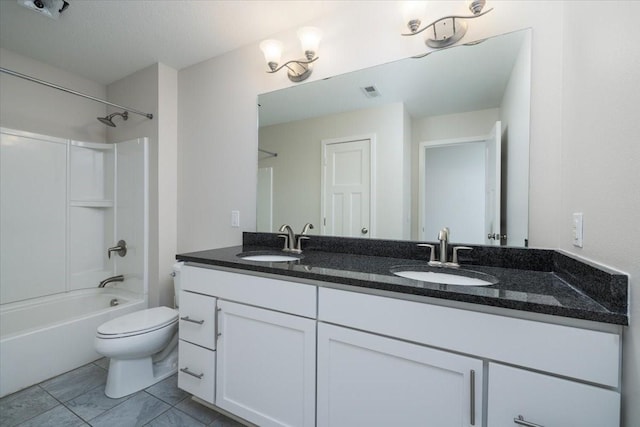 full bathroom featuring toilet, vanity, a textured ceiling, and shower / bath combination