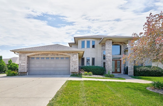 prairie-style house with a front lawn and a garage