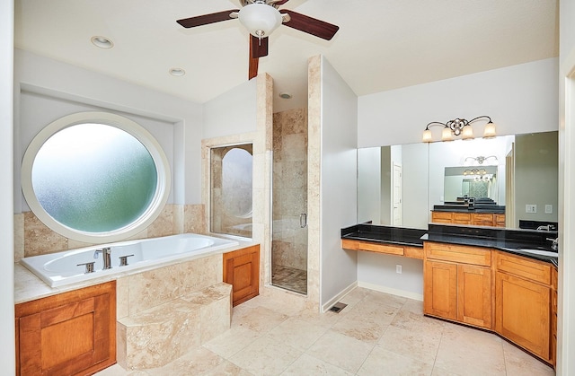 full bath with a shower stall, ceiling fan, a bath, and vanity