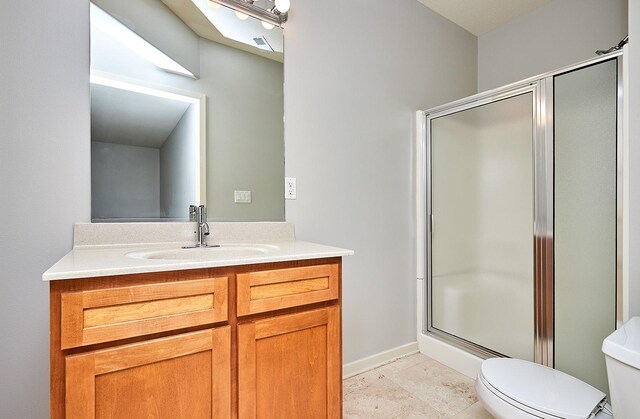 bathroom with toilet, a shower with shower door, and vanity