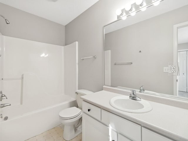 full bathroom featuring toilet, washtub / shower combination, and vanity