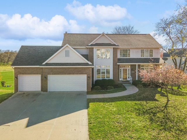 view of front of home featuring a garage and a front lawn