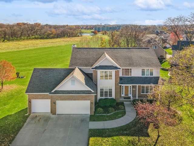 view of front of home featuring a front lawn and a garage