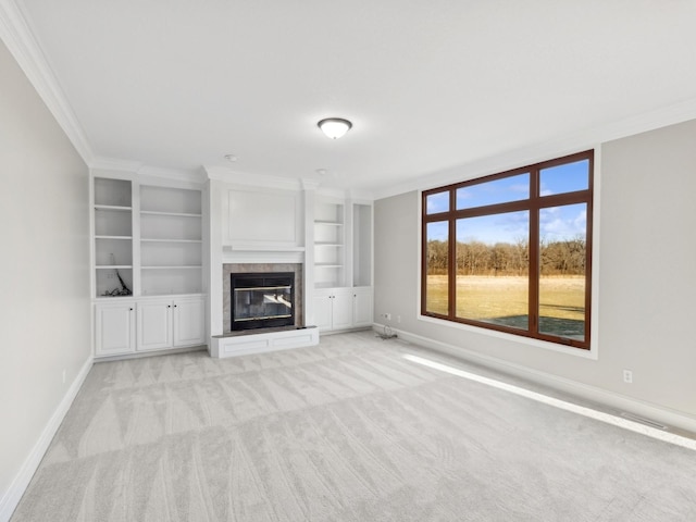 unfurnished living room with ornamental molding, built in features, and light carpet