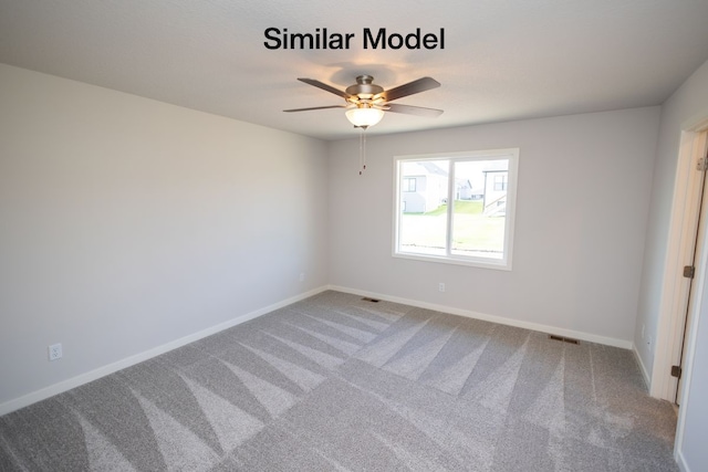 carpeted empty room with ceiling fan