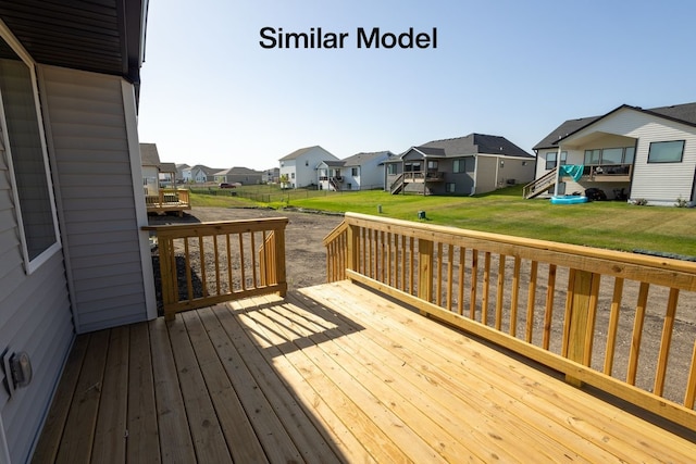 wooden terrace with a lawn