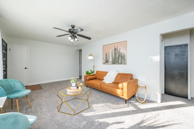 living room featuring ceiling fan and carpet floors