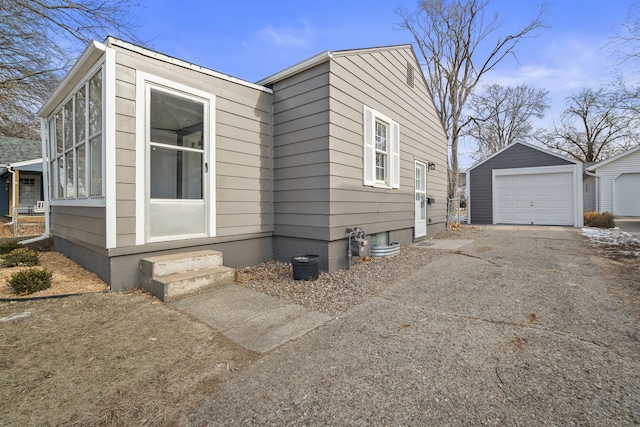 view of front of property with an outbuilding and a garage