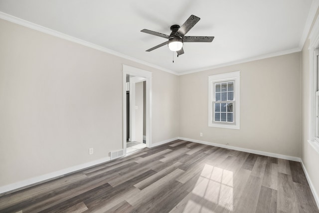 spare room with ceiling fan, ornamental molding, and hardwood / wood-style floors