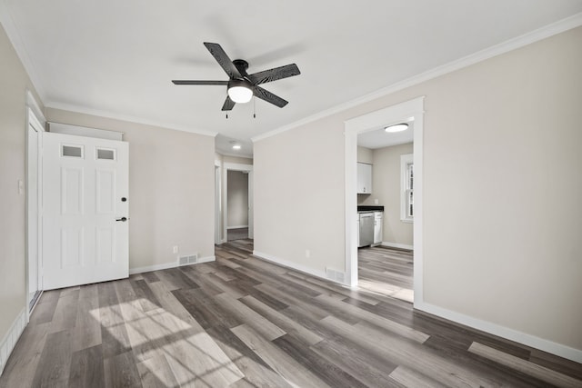 interior space featuring hardwood / wood-style floors, ceiling fan, and ornamental molding