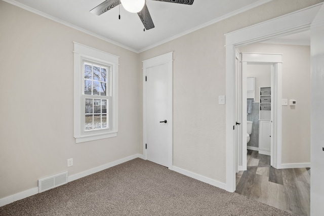 unfurnished bedroom featuring a closet, ceiling fan, carpet, and ornamental molding