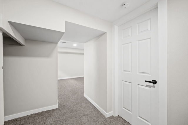 spacious closet featuring dark carpet