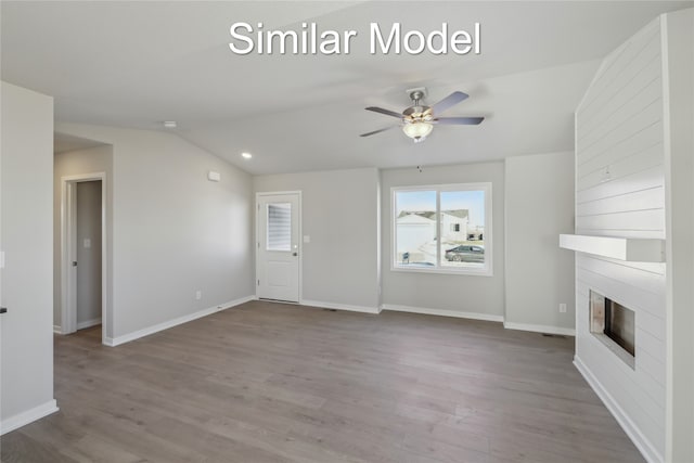 unfurnished living room featuring lofted ceiling, wood-type flooring, and ceiling fan