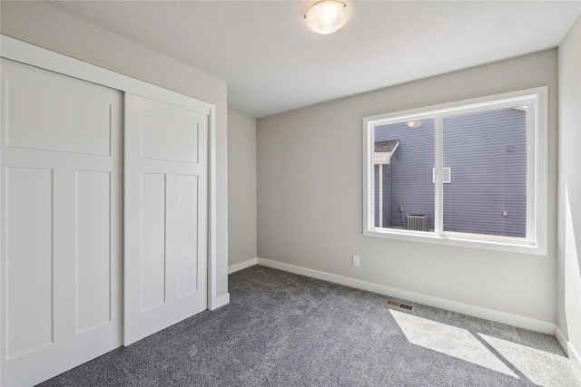 2008 White Oak Ln, Granger, IA 50109 - unfurnished bedroom featuring carpet floors and a closet