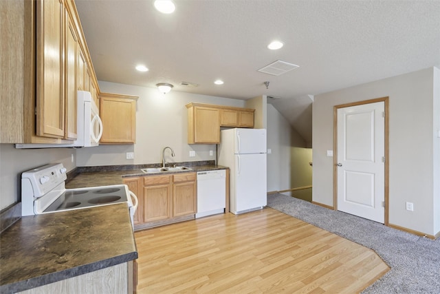 kitchen with sink, white appliances, light brown cabinetry, and light wood-type flooring