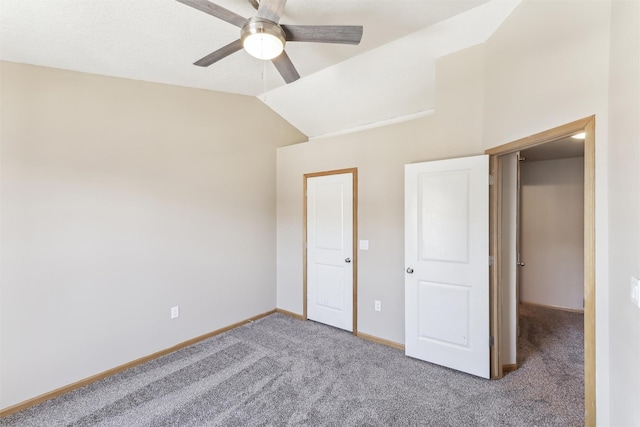 unfurnished bedroom featuring carpet floors, lofted ceiling, baseboards, and a ceiling fan