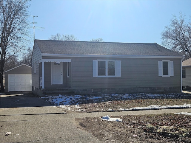 view of front of home with an outbuilding and a garage