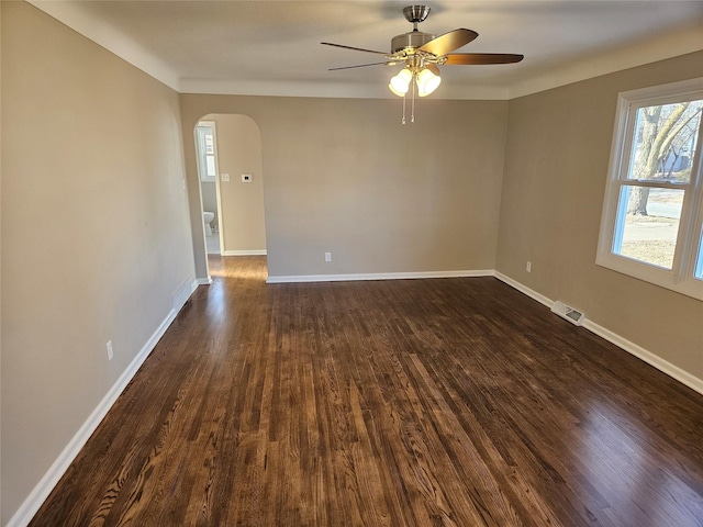 unfurnished room with ceiling fan and dark hardwood / wood-style floors