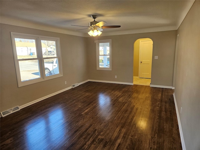 unfurnished room featuring ceiling fan and dark wood-type flooring