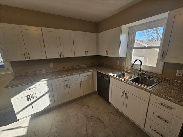 kitchen featuring sink, black dishwasher, white cabinetry, and dark stone counters