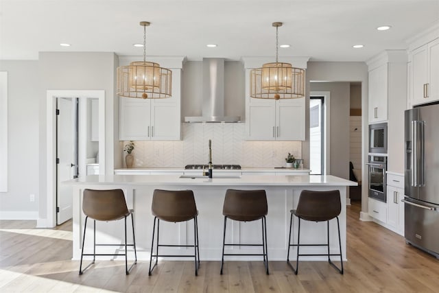 18256 Alderleaf Dr, Clive, IA 50325 - kitchen with wall chimney range hood, appliances with stainless steel finishes, an inviting chandelier, and light countertops
