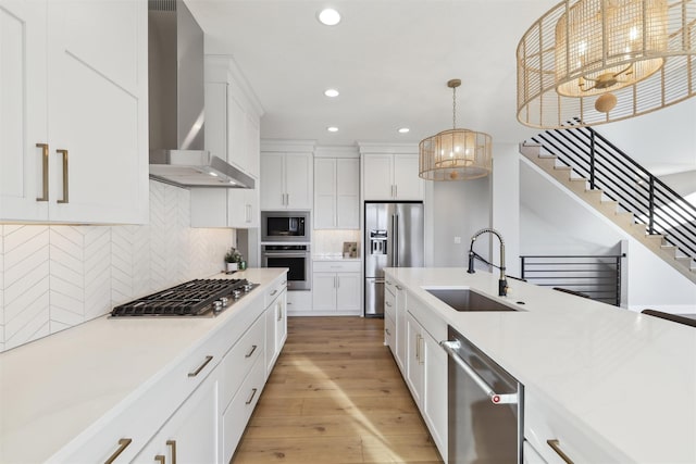 18256 Alderleaf Dr, Clive, IA 50325 - kitchen featuring wall chimney range hood, appliances with stainless steel finishes, a sink, light countertops, and recessed lighting
