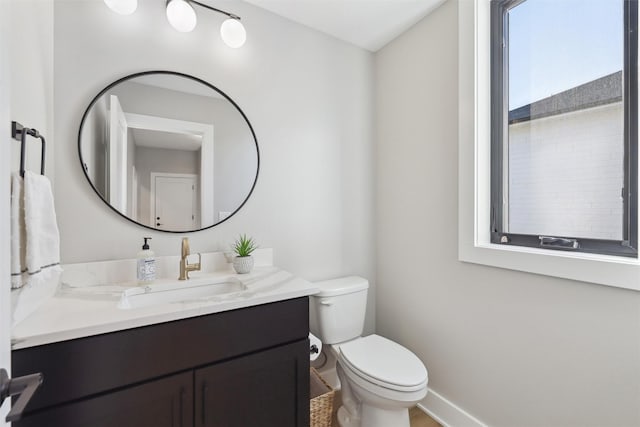 18256 Alderleaf Dr, Clive, IA 50325 - bathroom featuring baseboards, toilet, and vanity