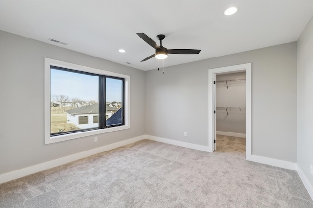 18256 Alderleaf Dr, Clive, IA 50325 - unfurnished bedroom with carpet floors, recessed lighting, baseboards, a spacious closet, and ceiling fan