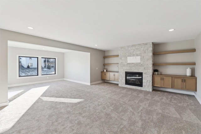 18256 Alderleaf Dr, Clive, IA 50325 - unfurnished living room with baseboards, a fireplace, carpet flooring, and recessed lighting