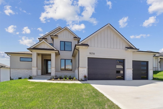 18256 Alderleaf Dr, Clive, IA 50325 - view of front facade with a garage, board and batten siding, concrete driveway, and a front lawn