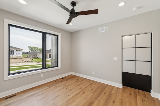 18256 Alderleaf Dr, Clive, IA 50325 - unfurnished room with ceiling fan, baseboards, light wood-style flooring, recessed lighting, and a smoke detector