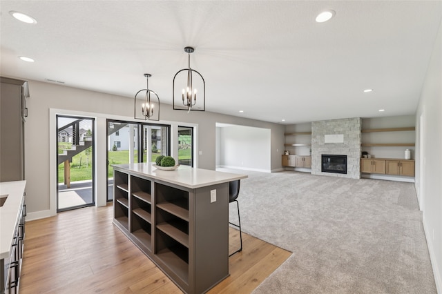 18256 Alderleaf Dr, Clive, IA 50325 - kitchen with open shelves, light countertops, decorative light fixtures, recessed lighting, and a breakfast bar