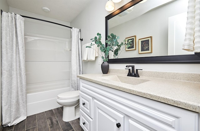 full bathroom with toilet, shower / tub combo, and vanity