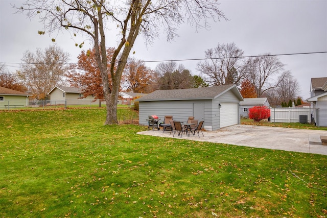 view of yard with central air condition unit, a patio area, and an outdoor structure